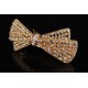 Заколка автоматическая под золото в виде бантика украшенная стразами