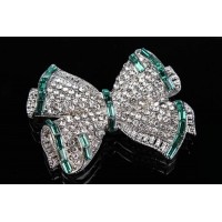 Брошь в виде бантика в стразах зеленая 1-183450